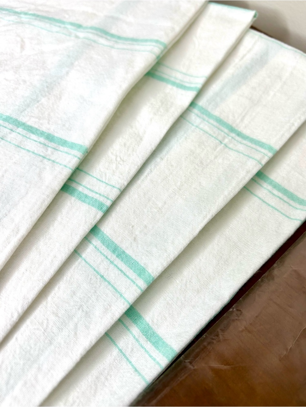 Set of 4 Anthropologie White Cotton napkins with Seafoam Green stripes